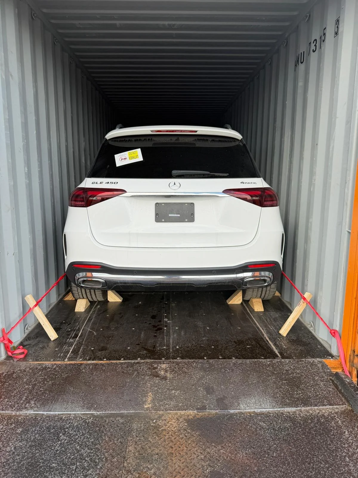 SUV secured in a container for export
